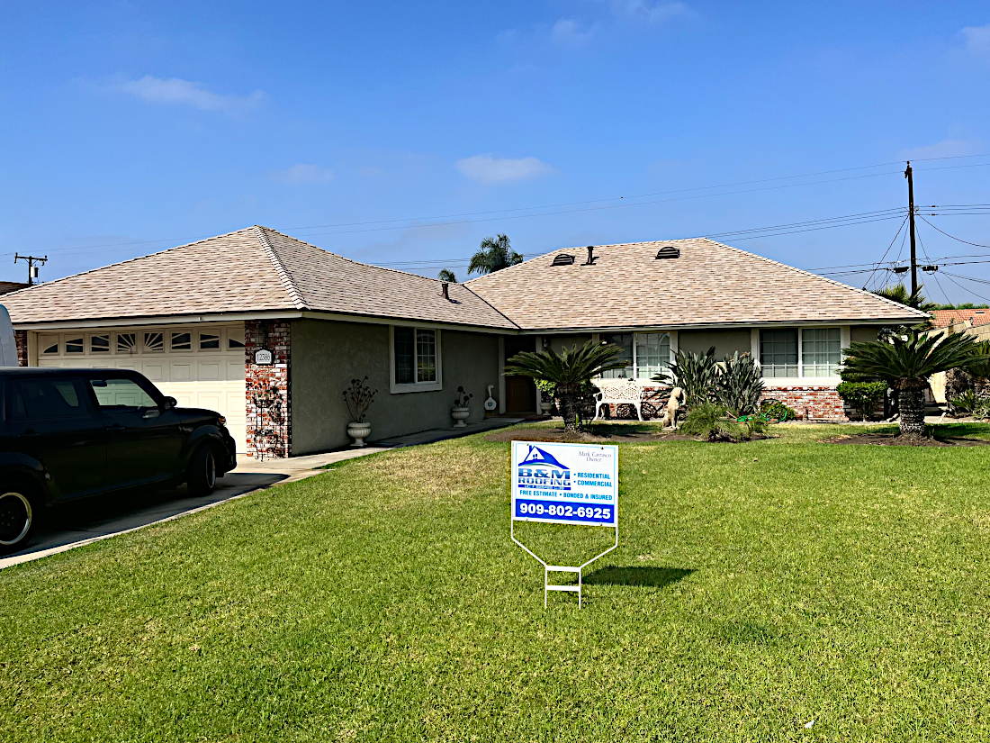 Residential home in Chino, CA with a newly installed asphalt shingle roof by B & M Roofing